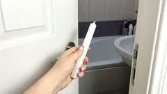 Once a month, I go into the bathroom and take a regular candle with me. This solves three problems at once.